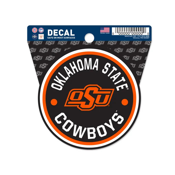 The Chill-N-Reel® Official NCAA Vinyl Decal Sticker is a 3.5” round sticker featuring "Oklahoma State Cowboys" and the orange OSU logo on a black background with orange and white border. Packaging shows various college team stickers and OSU logos.