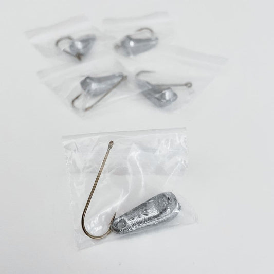 Five Extra Hook & Sinker Packs from Chill-N-Reel are individually packaged in small, clear plastic bags. One pack is in the foreground, and the other four are arranged in the background on a white surface.