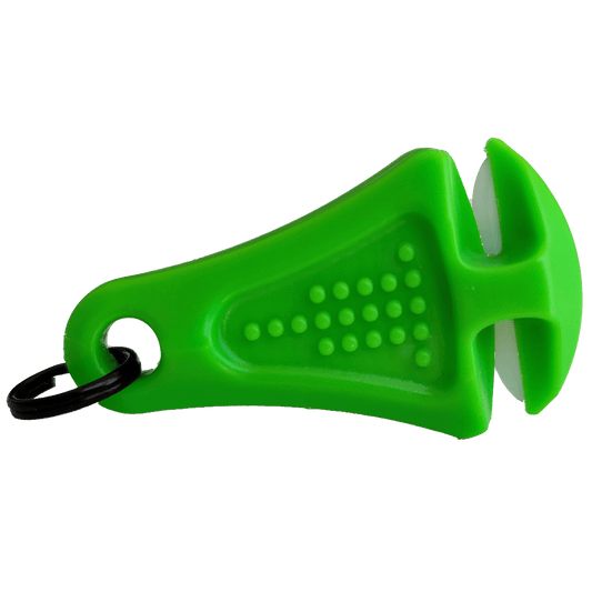The Line Cutterz Ceramic Blade Zipper Pull is a green plastic handheld tool with a black keyring and textured grip, featuring two white angled ceramic blades—perfect for opening packages, cutting plastic seals, or fishing lines.