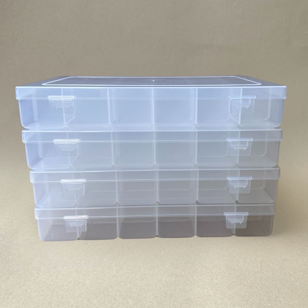 A set of three Fishing Tackle Box Sets with Adjustable Dividers and Size 3600 Trays by Chill-N-Reel®, featuring transparent, stackable plastic boxes elegantly displayed on a neutral beige background.