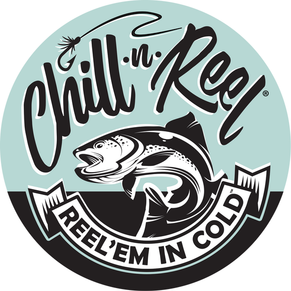 A graphic logo featuring a fish with an open mouth in the center. Above it is the text "Chill-n Reel" with a fishing fly lure design. Below, a ribbon banner reads "Reel'em In Cold." The background includes a teal circle and black and white elements.