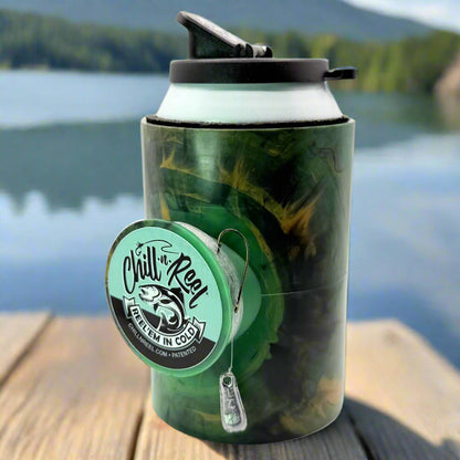 The Original Chill-N-Reel by Chill-N-Reel, a green and black insulated can cooler with a hand-line fishing reel, sits on wood with a blurred lake and mountains in the background.