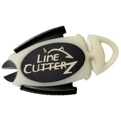 The Line Cutterz Dual Hybrid Micro Scissors by Line Cutterz are small, fish-shaped line cutters with a white body and black oval logo, featuring ceramic cutting technology for easy fishing line slicing.