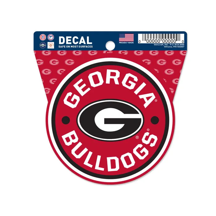 The Chill-N-Reel® Official NCAA Vinyl Decal Sticker is a 3.5" round decal featuring the Georgia Bulldogs "G" logo and team name on a red background with repeating logos. Officially licensed, it's safe for most surfaces and lets you show your team pride anywhere.