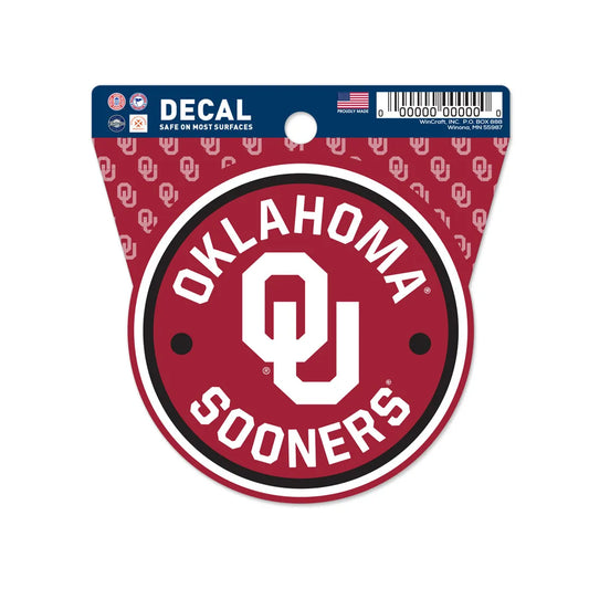 Show your team spirit with the Chill-N-Reel® Official NCAA Vinyl Decal Sticker, a 3.5” round decal featuring the Oklahoma Sooners "OU" logo and text in white on red—perfect for decorating any surface.